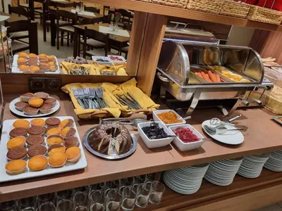 a buffet with many different types of food on display at Hotel Klara in Prague