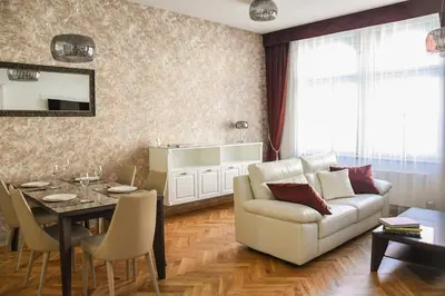 a living room with a couch and a table at High Heaven in Prague
