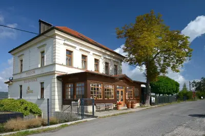 a building on the side of a street at Penzion Marjána in Mníšek pod Brdy