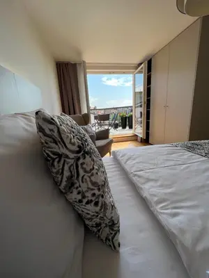 a bedroom with a bed with a pillow on it at CE Apartment Prague Castle in Prague