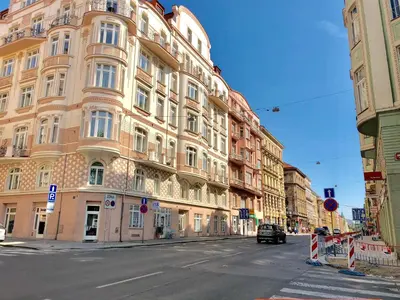 a large building on the side of a street at CE Apartment Prague Castle in Prague