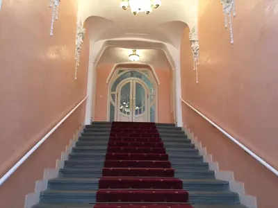 a staircase leading to a door in a building at CE Apartment Prague Castle in Prague