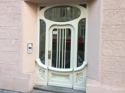 a white door in a building with a window at CE Apartment Prague Castle in Prague
