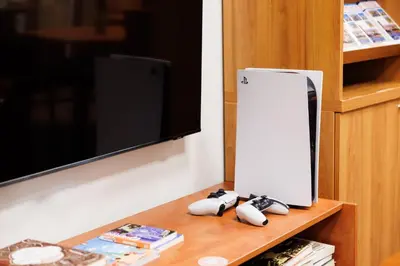 a nintendo wii game controllers sitting on a table next to a tv at Hapimag Apartments Prague in Prague