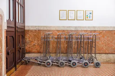 a group of carts in front of a wall at Hapimag Apartments Prague in Prague