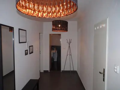 a living room with a couch and a lamp at The modern apartment in Prague