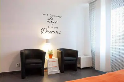 a waiting room with two chairs and a table at The modern apartment in Prague