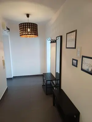 a flat screen tv sitting on top of a dresser at The modern apartment in Prague