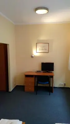 an office with a desk with a computer on it at Parkhotel Terezín in Terezín