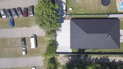 an overhead view of a roof of a house with parked cars at Apartmán Dubová in Milovice