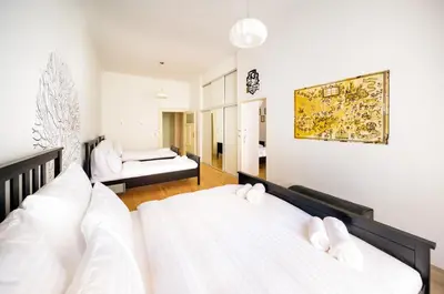two beds in a room with a bedroom at Amazing Harry Potter's apt. at Old Town in Prague