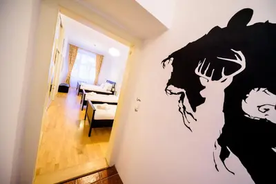 a room with a wall mural of a deer on the wall at Amazing Harry Potter's apt. at Old Town in Prague