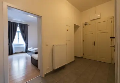 a room with a door and a room with a couch at Andel Centre SPIRIT in Prague