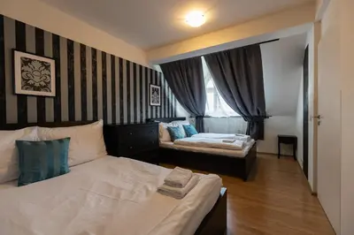 a bedroom with two beds and a window at Andel Centre SPIRIT in Prague