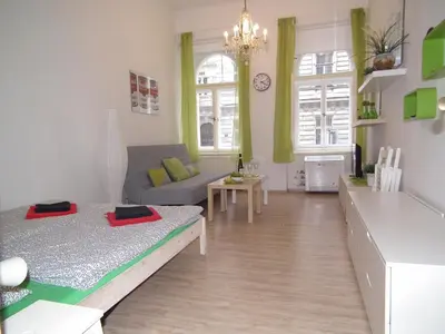 a living room with two beds and a couch at Apartment in the centre in Prague