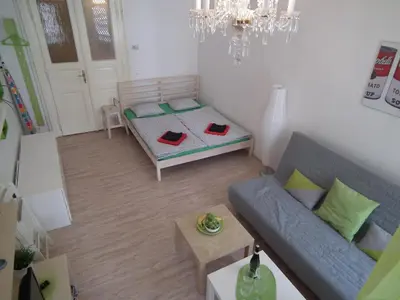 a living room with a couch and a table at Apartment in the centre in Prague