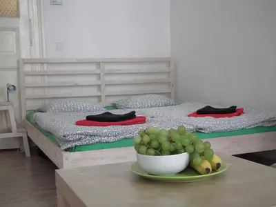 a bedroom with a bed and a bowl of grapes on a table at Apartment in the centre in Prague