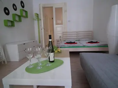 a room with a table with wine glasses on it at Apartment in the centre in Prague