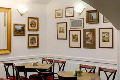 a group of glasses of milk and waffles on a buffet at Hotel Orion in Prague