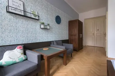 a living room with a couch and a table at Great place near city centre in Prague