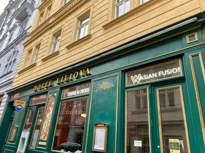 a green store front of a building on a street at SPA Hotel Liliova Prague Old Town in Prague