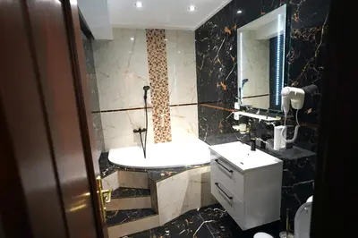 a bathroom with a sink and a mirror at SPA Hotel Liliova Prague Old Town in Prague