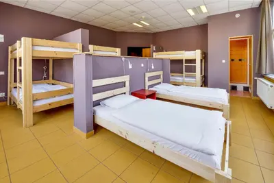 a room with three bunk beds in a room at Plus Prague in Prague