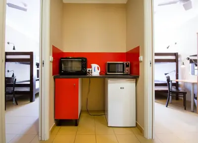 a small kitchen with two microwaves on a counter at Plus Prague in Prague