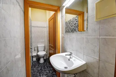 a bathroom with a sink and a toilet at Plus Prague in Prague