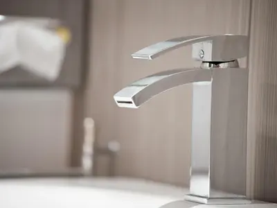 a bathroom sink with a silver faucet at Hotel PurPur in Prague