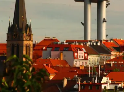 a view of a city with a clock tower and buildings at LOVELY Prague Apartment in Prague