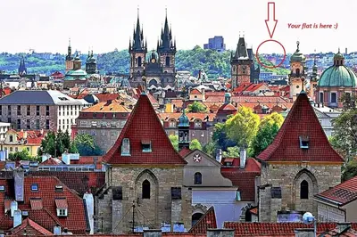a view of a city with roofs of buildings at LOVELY Prague Apartment in Prague
