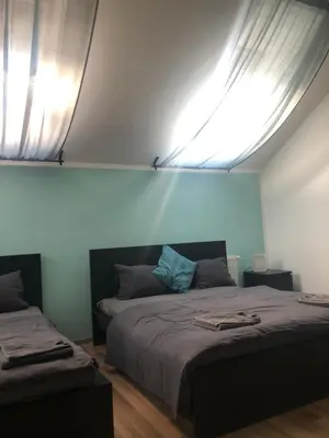 a bedroom with two beds and a window at Old Strand Spirit in Prague