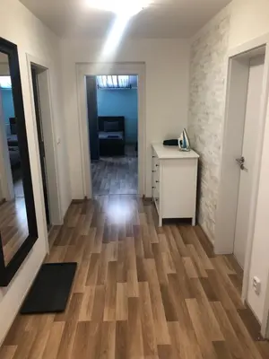 an empty room with a desk and a hallway at Old Strand Spirit in Prague