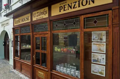 a store front of a bakery with a display window at Penzion U Zámku in Mělník