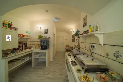 a kitchen with two sinks and a counter top at Penzion U Zámku in Mělník