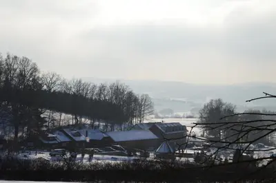 a playground with a bunch of slides and a building at Resort Hulín in Sedlčany