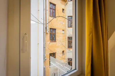 a window with a view of a building at Self-service Hotel Ostaš Praha in Prague