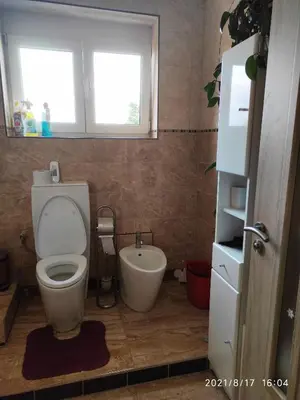 a bathroom with a toilet and a sink at Rezidence Jiskra in Brandýs nad Labem-Stará Boleslav