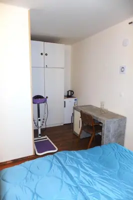 a bedroom with a bed and a desk and a table at Rezidence Jiskra in Brandýs nad Labem-Stará Boleslav