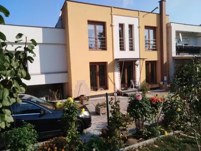 a house with a car parked in front of it at Rezidence Jiskra in Brandýs nad Labem-Stará Boleslav