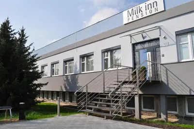 a building with a staircase on the side of it at Pension Milk Inn in Prague
