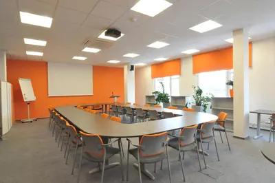 a conference room with a large table and chairs at Pension Milk Inn in Prague