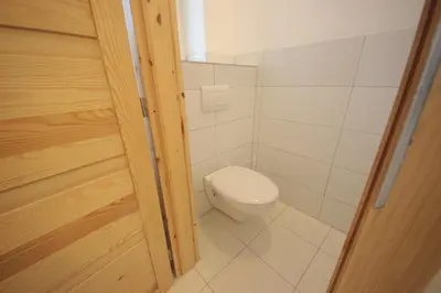 a small bathroom with a toilet in a room at Gallery Apartment in Prague