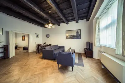 a living room with a couch and a table at St. George Apartments in Prague