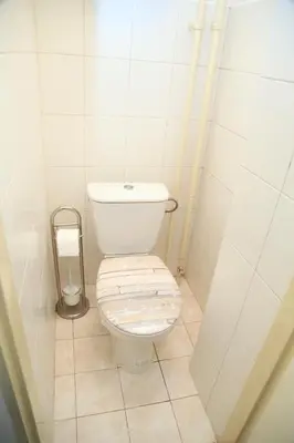 a small bathroom with a toilet in a stall at Old Town studio in Prague