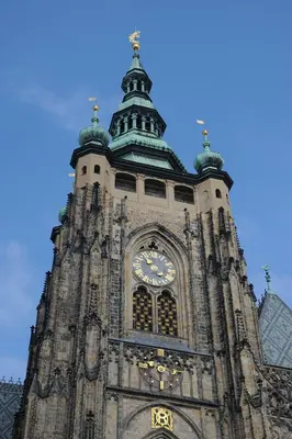 a tall clock tower with a clock on it at Karlova Apartment in Prague