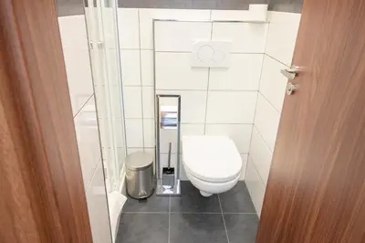 a bathroom with a toilet and a mirror at Narodni Stay in Prague