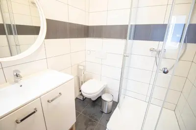 a bathroom with a toilet sink and a shower at Narodni Stay in Prague