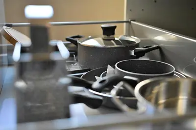 a stove top with a pot on top of it at Apartment in the heart of Prague in Prague